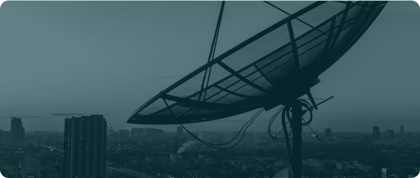 Satellite communications dish overlooking a city